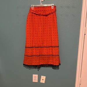 Top/Skirt set.  Orange with navy detail.  like new condition